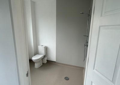 Hotfield brain centre, healthcare construction project, residential rooms refurbishment with wet room bathroom.