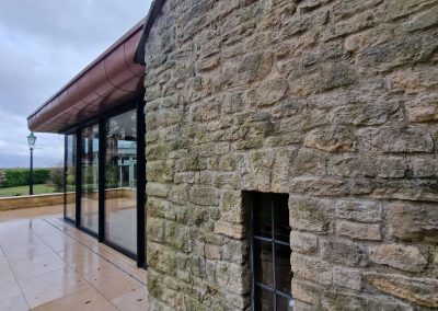 Side view of residential extension project on a traditional Oxford stone house mixing traditional and modern. Residential building projects by Lakeridge Solutions.